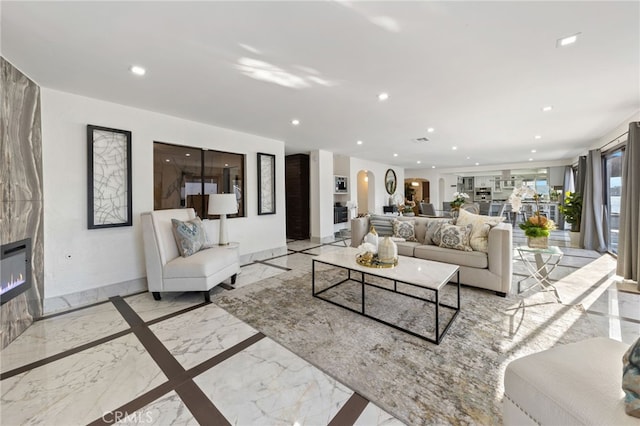 living room featuring a fireplace