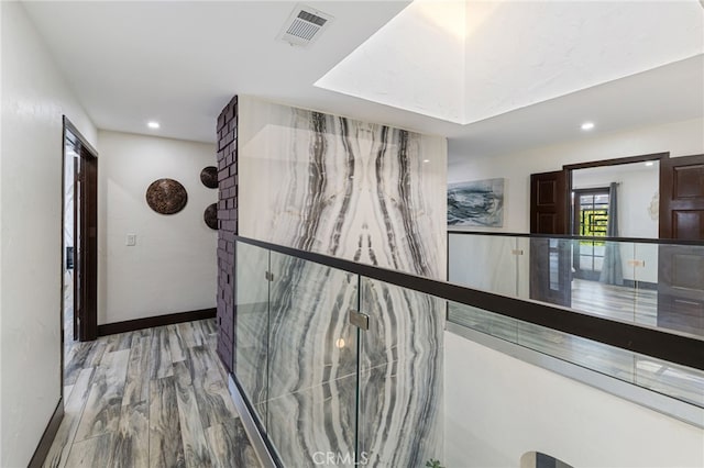 hall featuring light hardwood / wood-style floors