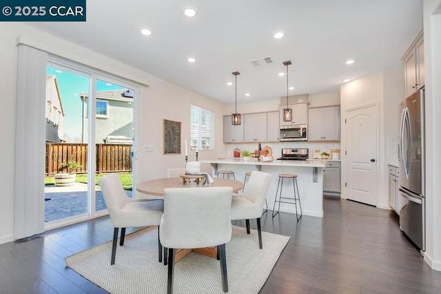 dining area featuring dark hardwood / wood-style floors