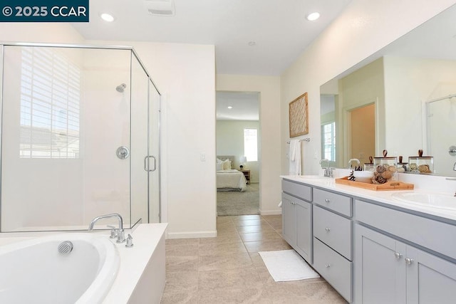 bathroom featuring vanity, tile patterned floors, and separate shower and tub