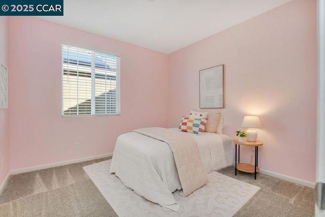 bedroom with light colored carpet