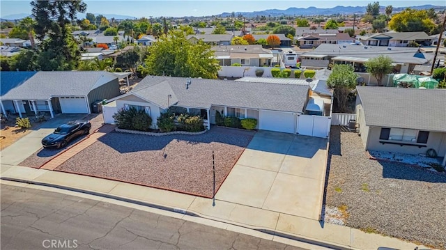 birds eye view of property with a mountain view