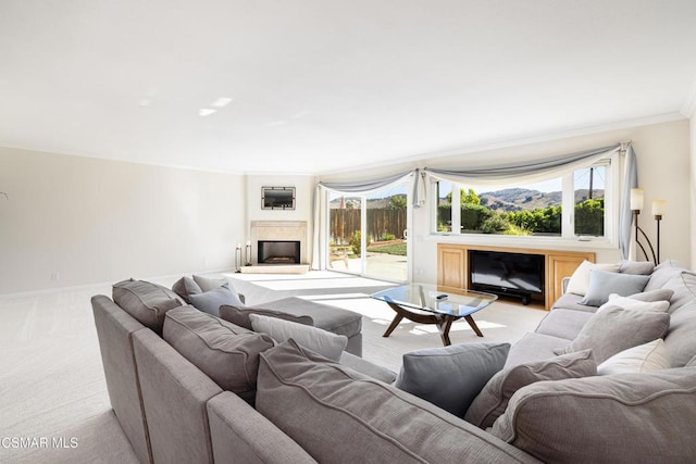 living room featuring ornamental molding and light carpet