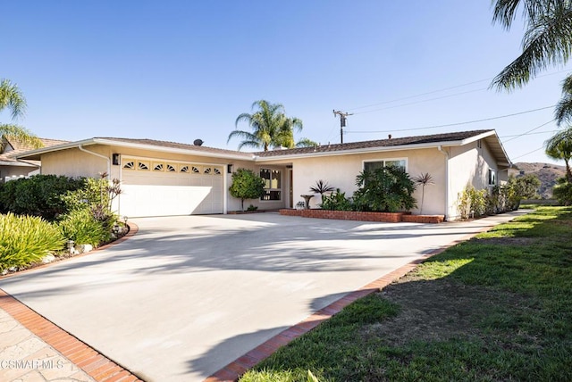 ranch-style home featuring a garage