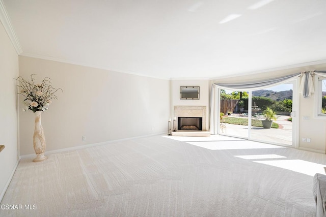 unfurnished living room featuring crown molding and light colored carpet