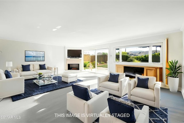 living room with ornamental molding and plenty of natural light