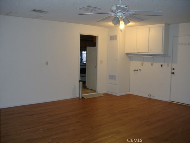 unfurnished room featuring hardwood / wood-style floors, a textured ceiling, and ceiling fan