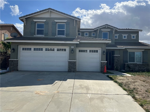 view of front of property with a garage