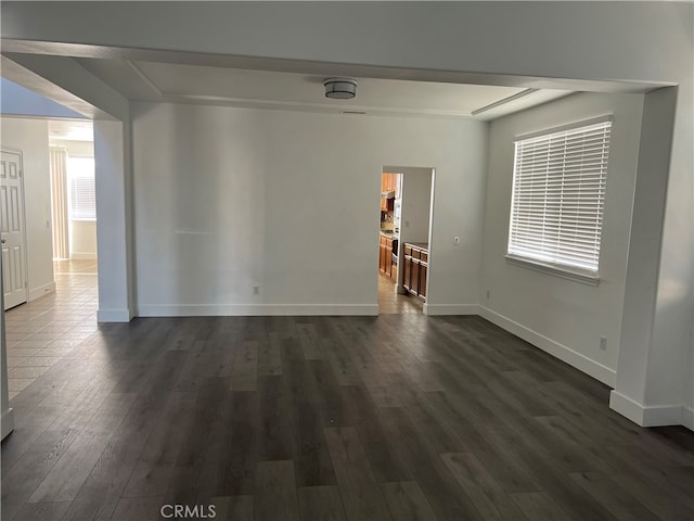 empty room featuring dark hardwood / wood-style flooring