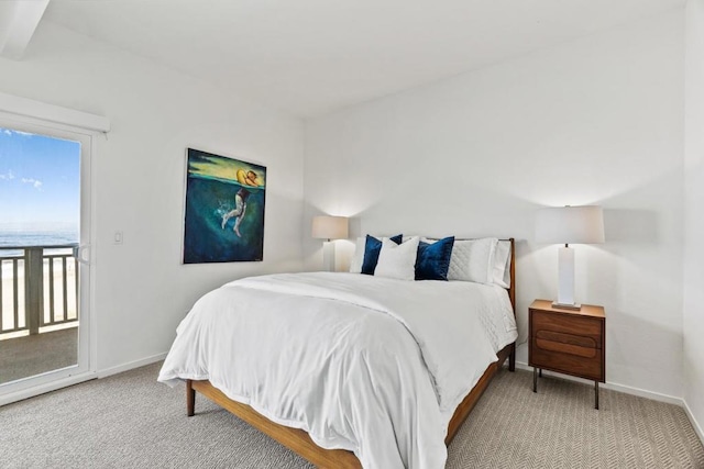 bedroom featuring access to outside and carpet flooring