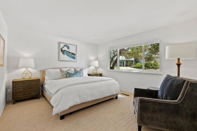 bedroom with light carpet