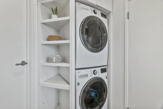 laundry area with stacked washer and dryer