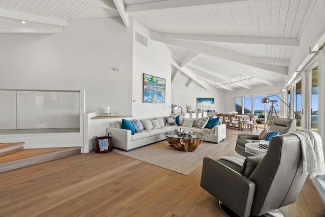 living room with wood ceiling, lofted ceiling with beams, and hardwood / wood-style flooring