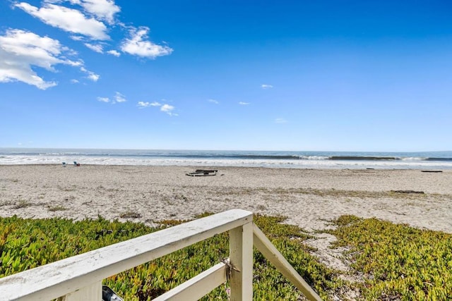 property view of water featuring a beach view