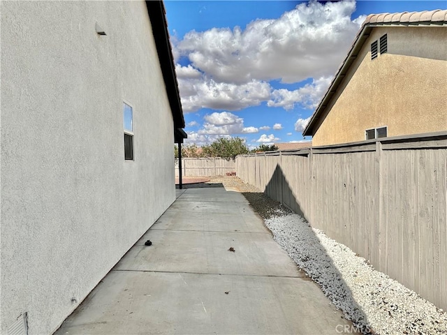 view of property exterior featuring a patio