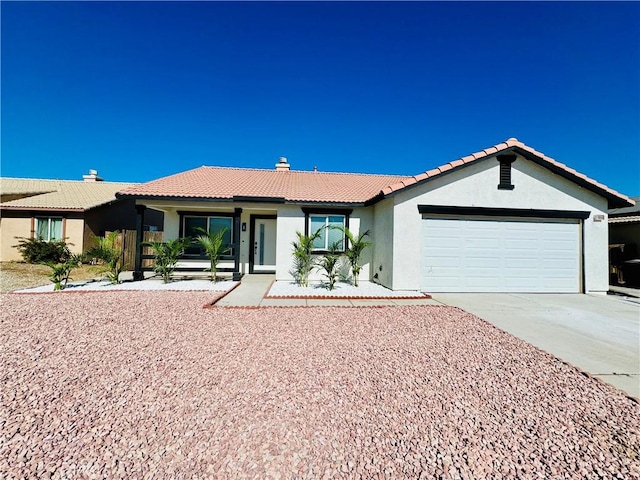 ranch-style house featuring a garage