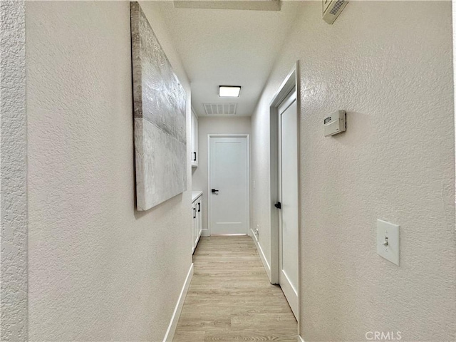 hallway featuring light wood-type flooring