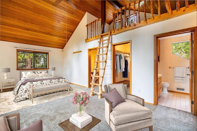 bedroom with carpet, high vaulted ceiling, ensuite bathroom, a spacious closet, and wood ceiling