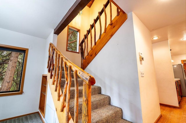 stairway featuring hardwood / wood-style flooring