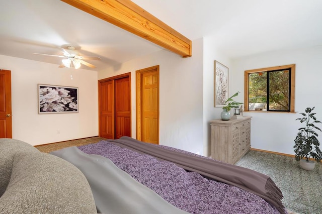 bedroom with carpet floors, ceiling fan, and beamed ceiling