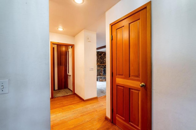 hallway with light hardwood / wood-style flooring