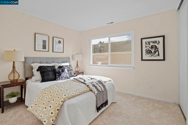 bedroom with light colored carpet