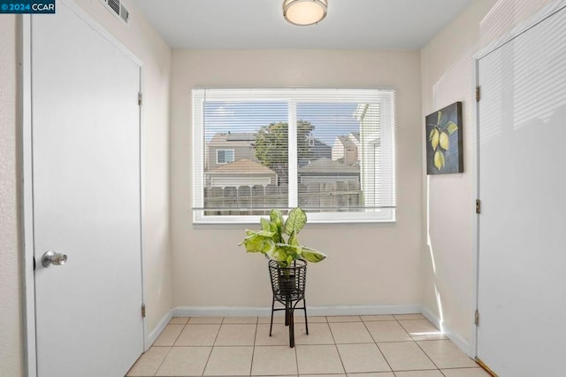 interior space with light tile patterned flooring