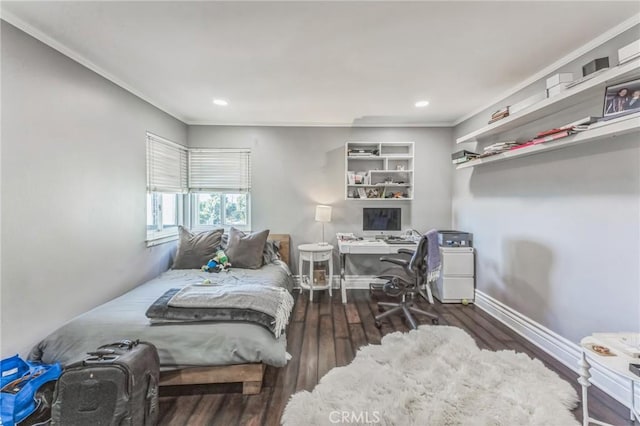 bedroom featuring crown molding and dark hardwood / wood-style flooring