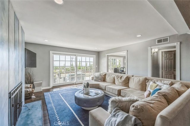 living room featuring dark wood-type flooring