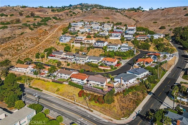 birds eye view of property featuring a mountain view