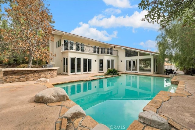 view of swimming pool featuring a patio area