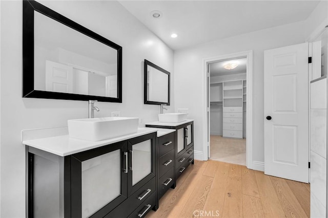 bathroom featuring vanity and hardwood / wood-style flooring