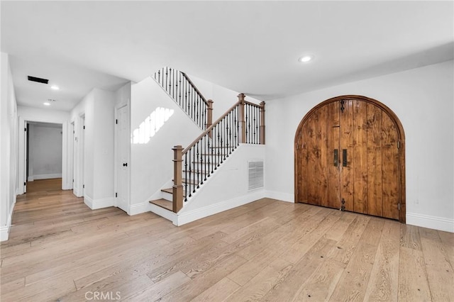 foyer entrance with light hardwood / wood-style flooring