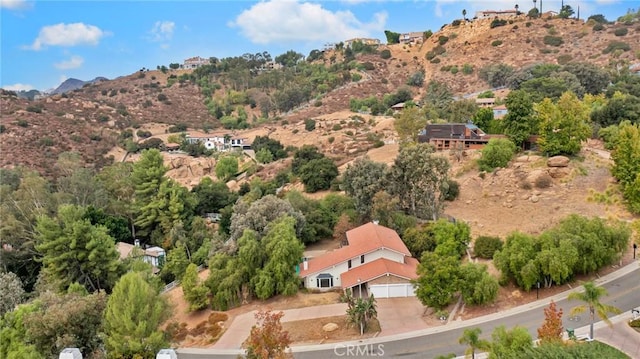 birds eye view of property with a mountain view