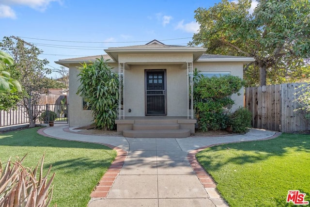 view of front of home with a front lawn