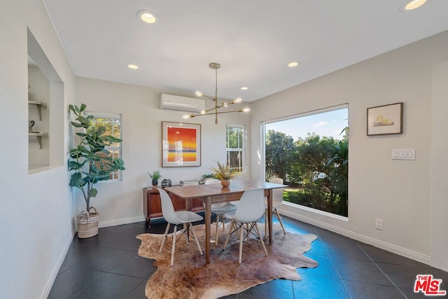 tiled dining area featuring a chandelier and an AC wall unit