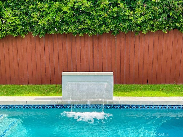 view of pool featuring pool water feature