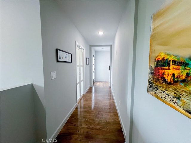 corridor featuring dark wood-type flooring