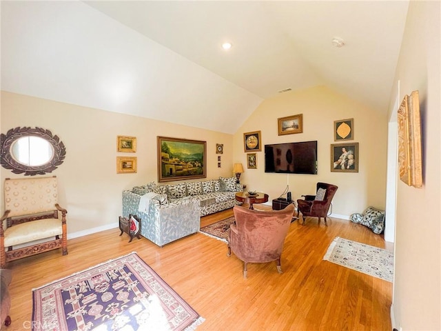 living room with wood-type flooring and lofted ceiling