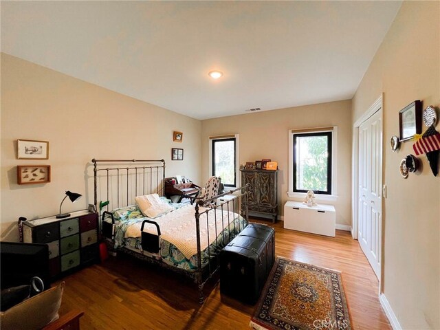 bedroom featuring a closet and hardwood / wood-style floors