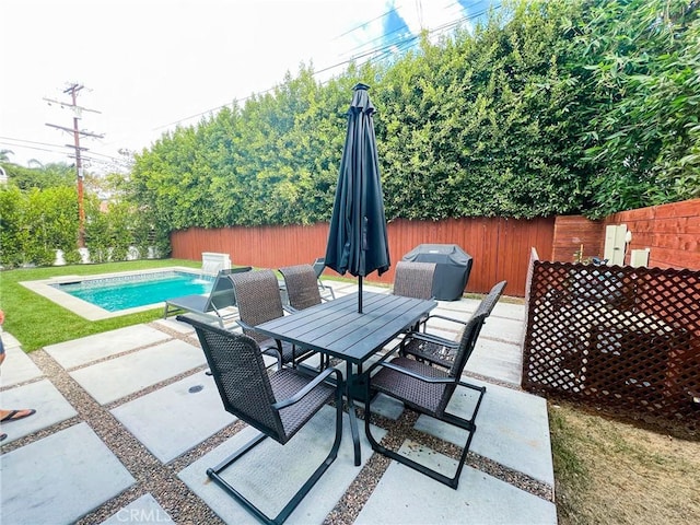 view of patio / terrace featuring pool water feature and a fenced in pool