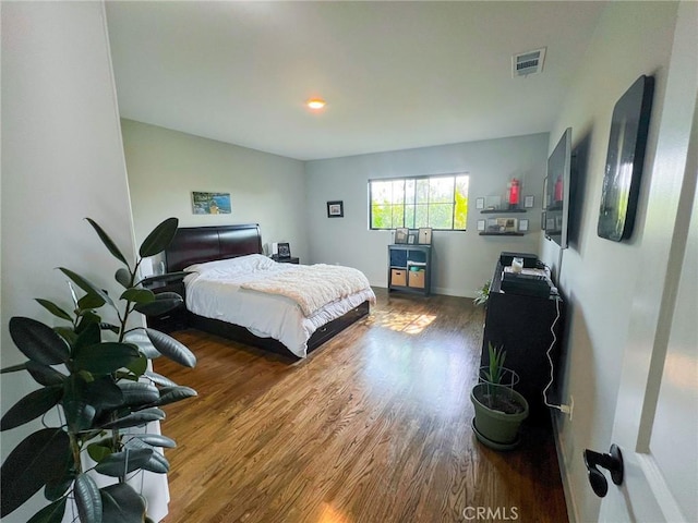 bedroom with hardwood / wood-style floors