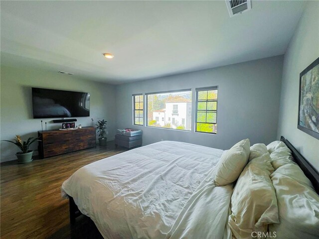 bedroom featuring dark hardwood / wood-style floors