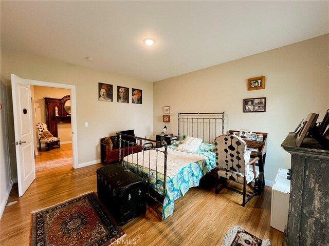 bedroom featuring hardwood / wood-style floors