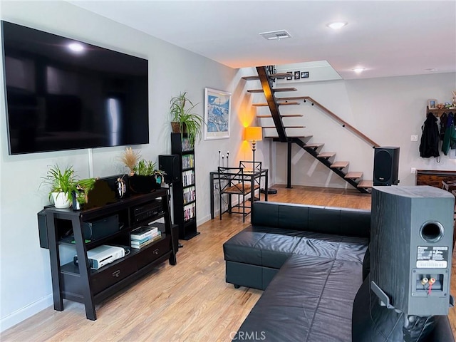 living room with light hardwood / wood-style floors