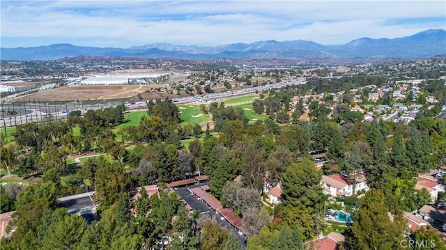 birds eye view of property with a mountain view