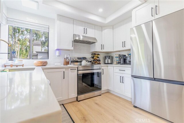 kitchen with white cabinetry and stainless steel appliances