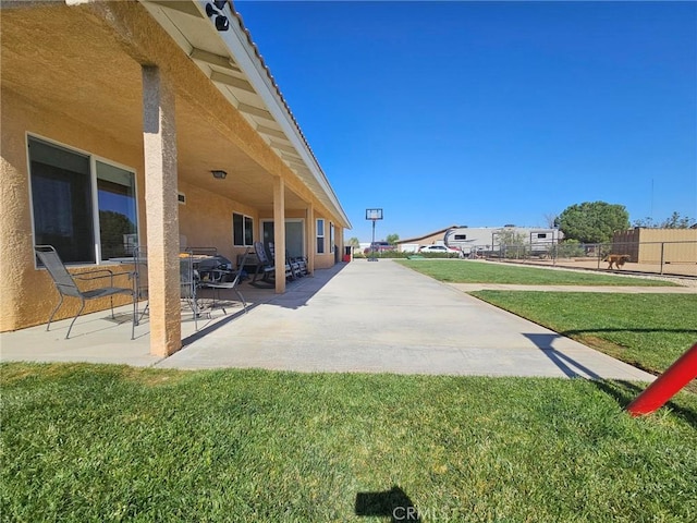 exterior space featuring a patio area and fence