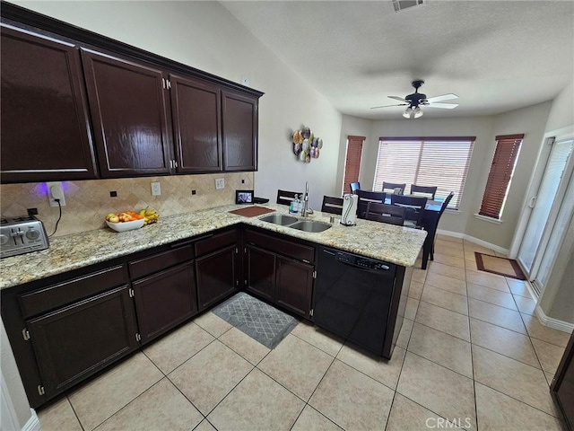 kitchen featuring light tile patterned floors, a peninsula, a sink, decorative backsplash, and dishwasher