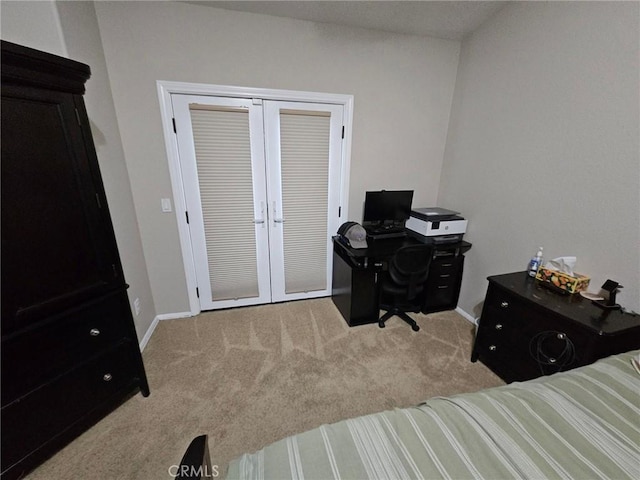 bedroom featuring french doors, a closet, carpet flooring, and baseboards